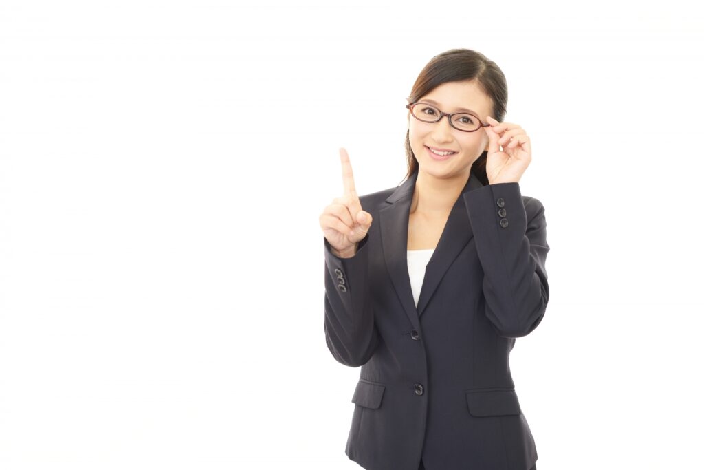 画像 人差し指を立てる女性
