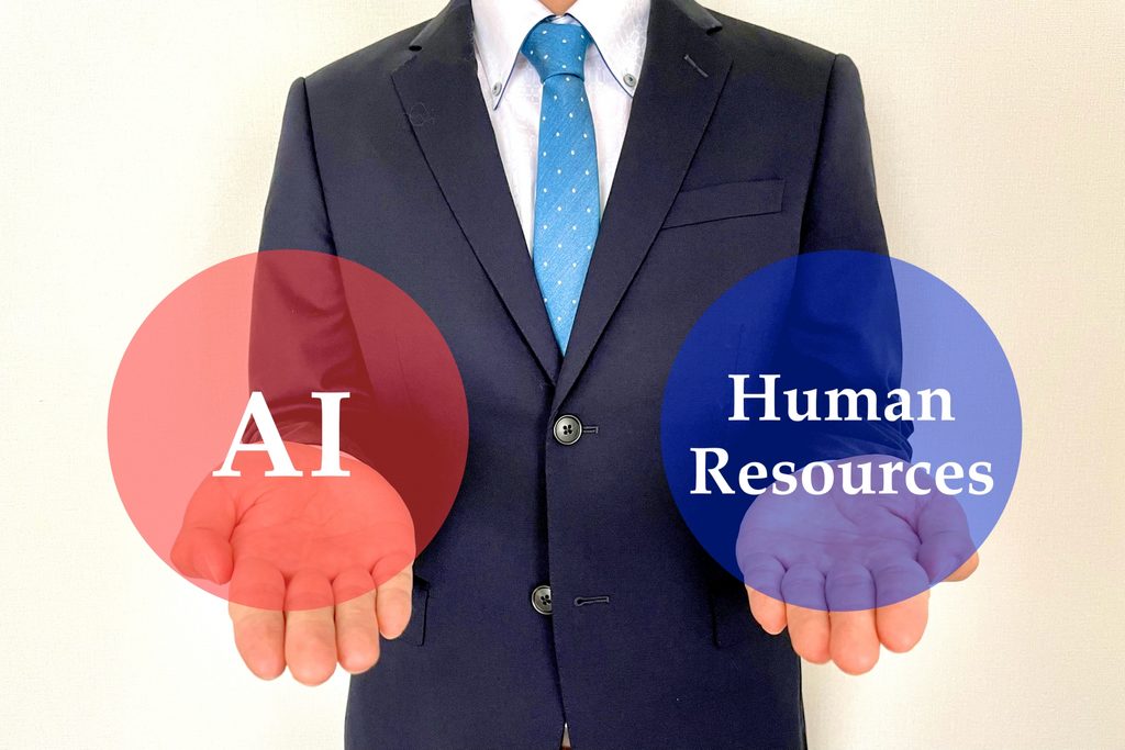 画像 AI活用において人間との業務をそれぞれ表しているビジネスパーソン